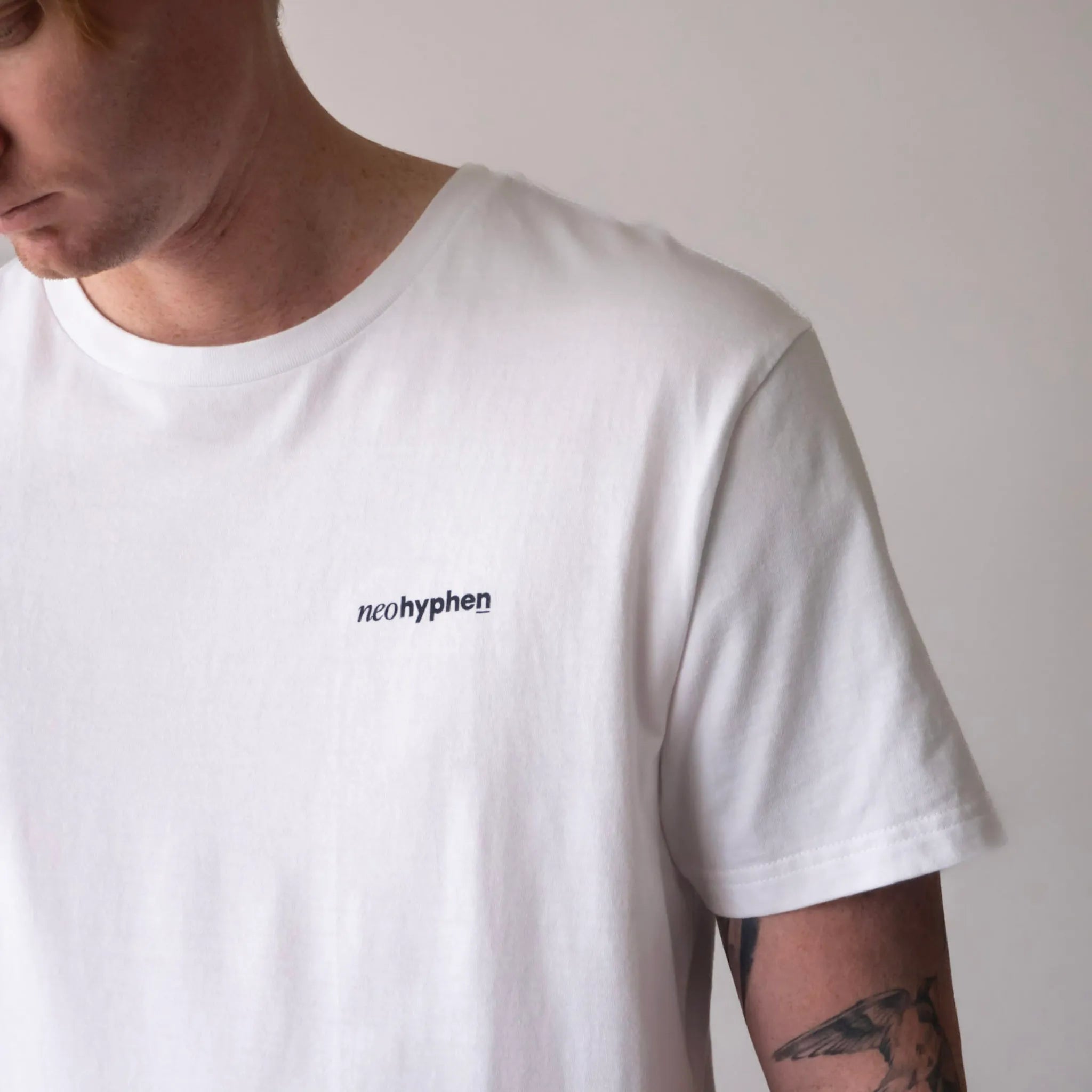 Neo Hyphen Syndicate of Underdogs white t-shirt made from 100% organic cotton, relaxed fit showcasing a minimal logo.